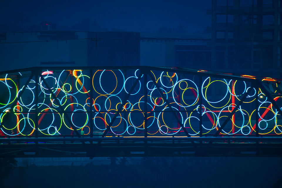 The Ysalina Bridge over the Cagayan de Oro River in the Philippines is illuminated with a variety of vibrant colors.