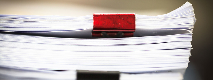 papers with red clip