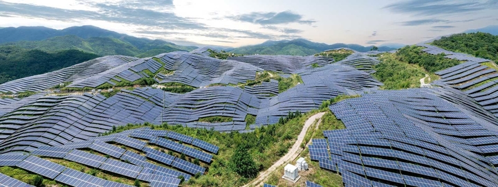 Solar panels on mountains aerial shot