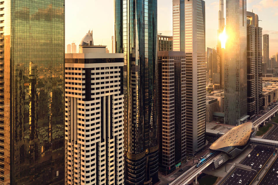 Golden hour view of residential skyscrapers on Sheikh Zayed Road