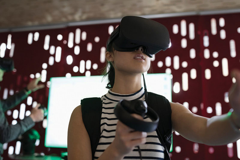 Woman usng Virtual Reality technology