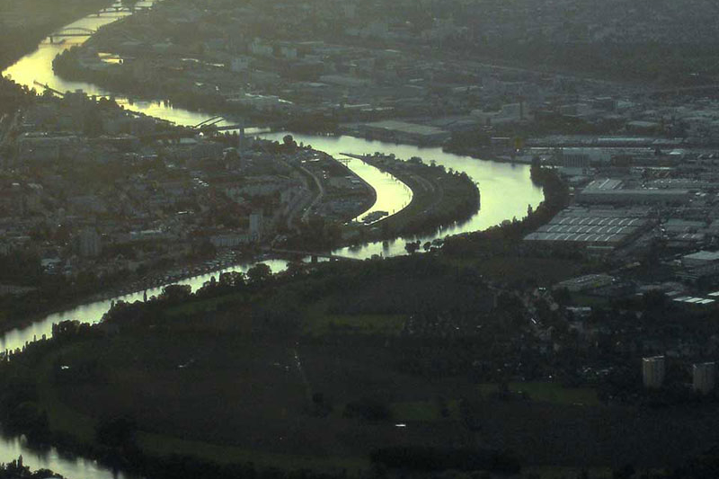 aerial view of a river through a city in Western Europe