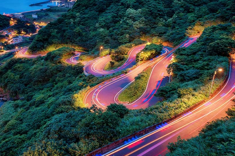 curve of coastline heading to the ocean