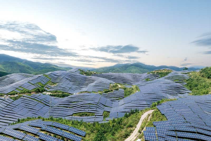 Solar panels on mountains aerial shot