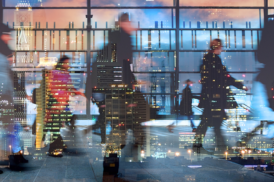 Workers leaving the office at night in the United Arab Emirates.