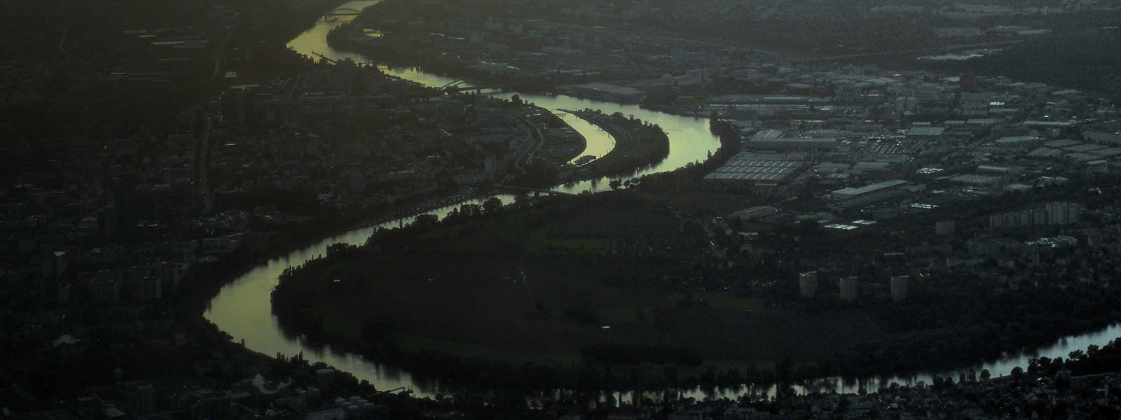 aerial view of a river through a city in Western Europe