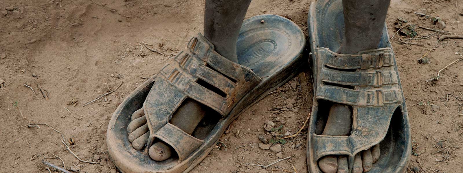 A boy wearing sandals