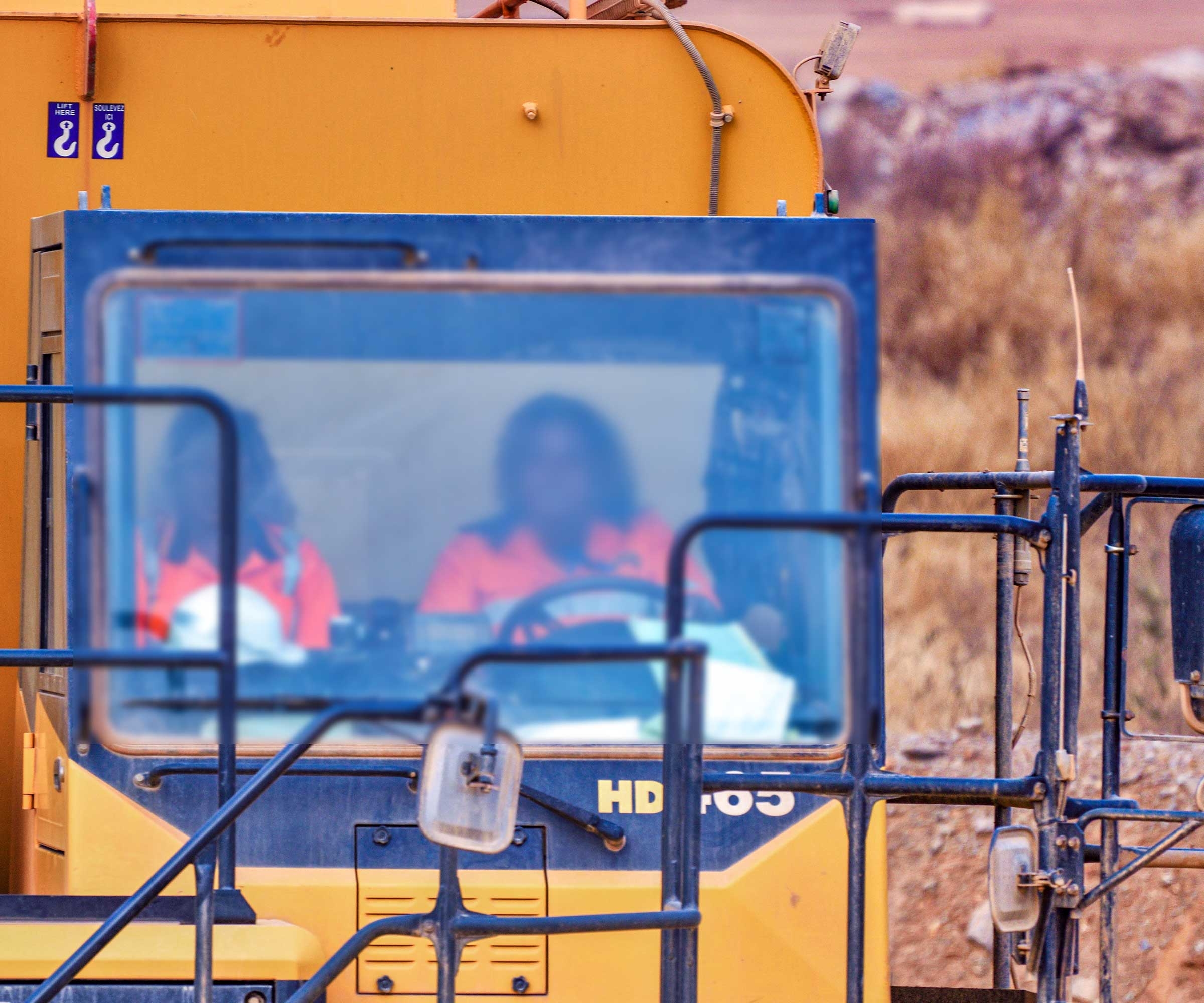 A woman drives a truck at a mining site in Burkina Faso. © Anne Mimault/Reuters