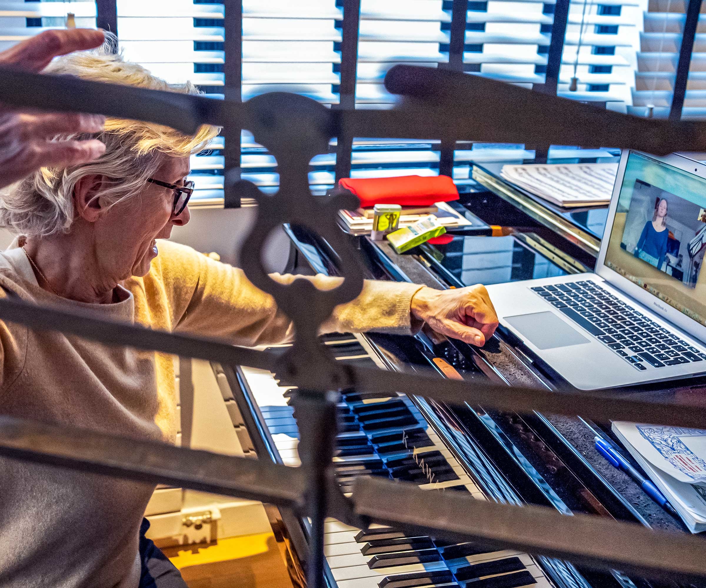 A professor of voice at a Paris music conservatory teaching an online class. © Richard Kalvar/Magnum Photos