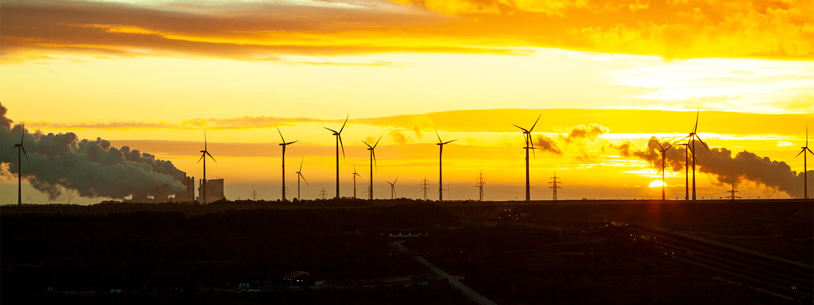 sunset at a windmill farm